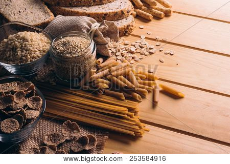Wooden Table Full Of Fiber-rich Whole Foods, Perfect For A Balanced Diet
