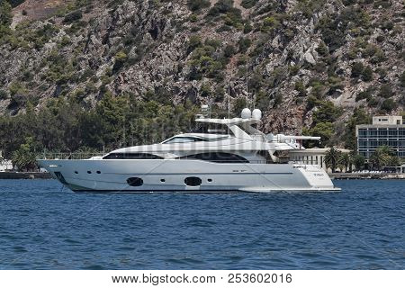 Yacht Starship Georgetown At The Pier Of Loutraki. In This Famous Town Often Come Expensive Yachts