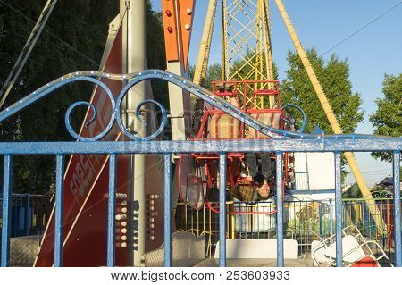 The Guy Sits On The Carousels In Gagarin Park, July 1, 2018, Russia, The City Of Sterlitamak