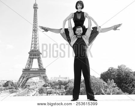 Dance Couple In Front Of Eifel Tower In Paris, France. Beatuiful Ballroom Dance Couple In Dance Pose