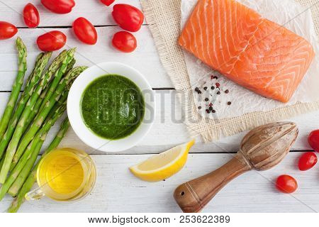 Fresh Salmon Fillet, Pesto Sauce, Cherry Tomatoes, Lemon, Olive Oil And Asparagus. Ingredients Fo Sa