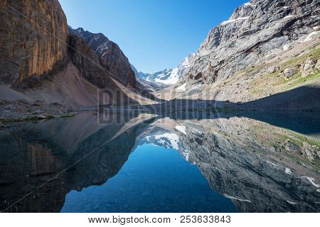 Beautiful serene lake in  Fann mountains (branch of Pamir) in Tajikistan.