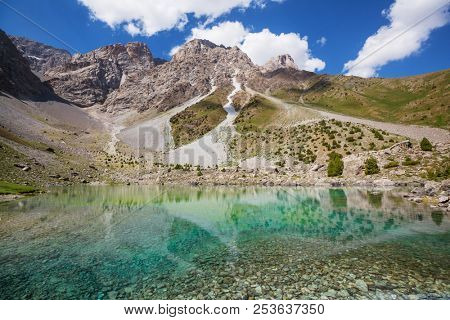 Beautiful serene lake in  Fann mountains (branch of Pamir) in Tajikistan.