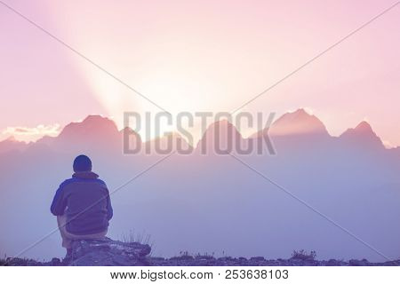 Wanderlust time. Man hiking in beautiful Fann mountains in Pamir, Tajikistan. Central Asia.