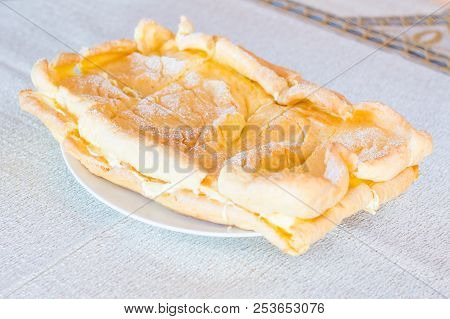 Homemade Sweet Polish Cream Pie Karpatka On White Plate.