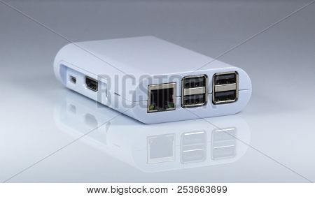 Rj45 And Usb Ports Of Tiny Computer. On Mirror Table.