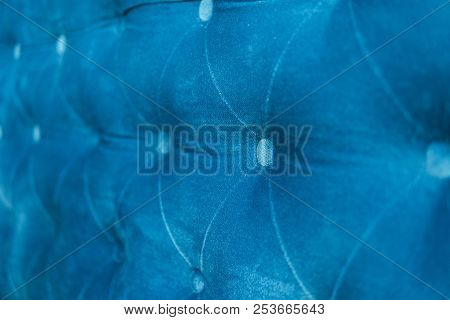 Velour Surface Of Sofa Close-up. Coach-type Velours Screed Tightened With Buttons. Blue Chesterfield