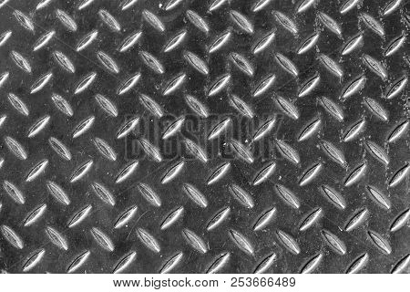 Steel Dirty And Used Checker Plate Metal Sheet. Can Be Use As Background Or Texture.