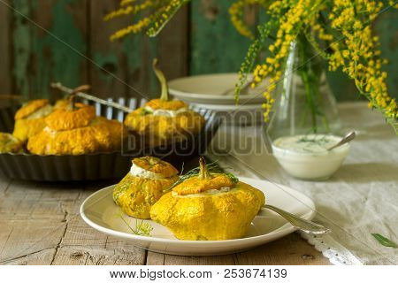 Pattypan Squash Or Pumpkins Stuffed With Ricotta With Basil And Dill And Served With Sour Cream Sauc