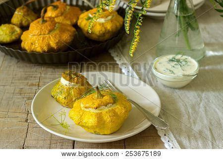 Pattypan Squash Or Pumpkins Stuffed With Ricotta With Basil And Dill And Served With Sour Cream Sauc