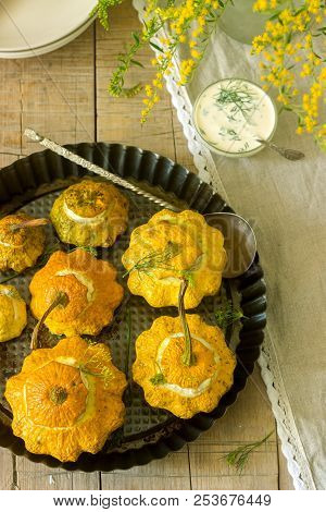 Pattypan Squash Or Pumpkins Stuffed With Ricotta With Basil And Dill And Served With Sour Cream Sauc