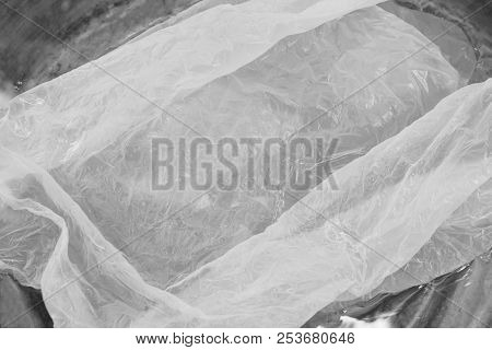Close Up Of Plastic Bag Floating On Water Surface