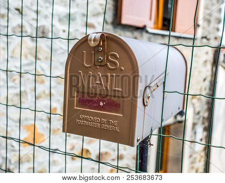 Front Door Of A Mailbox Mounted On The House Gate