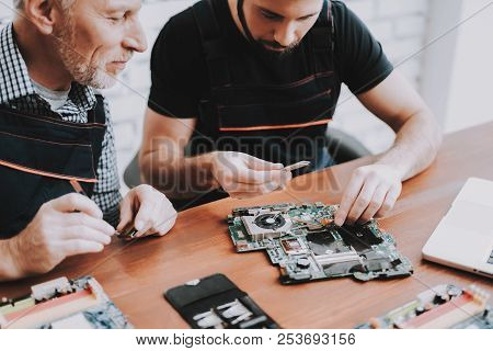 Two Men Repairing Hardware Equipment From Pc. Repair Shop. Worker With Tools. Computer Hardware. You