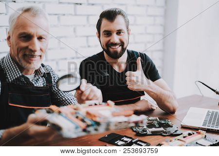 Two Men Repairing Hardware Equipment From Pc. Repair Shop. Worker With Tools. Computer Hardware. You