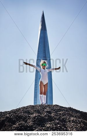 Girl With Open Hand Near The Rocket