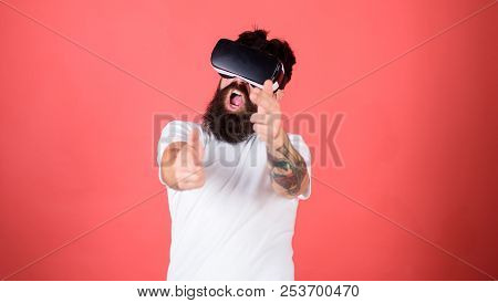 Shooting Gallery Vr. Man Bearded Hipster With Virtual Reality Headset On Red Background. First Perso