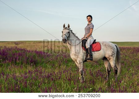 Horsewoman Jockey In Uniform Riding Horse Outdoors