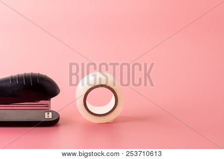 Stapler And Tape On Pink Background Back To School Education With Copy Space