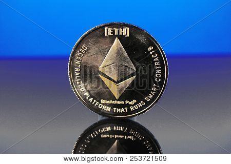 Etherum Money Crypto Currency Coin On Reflective Colorful Background