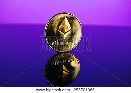 Etherum Money Crypto Currency Coin On Reflective Colorful Background