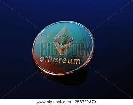 Etherum Money Crypto Currency Coin On Reflective Colorful Background