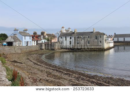 View Of The Pictureque Harbour And Surrounding Buildings At The Isle Of Whithorn In Dumfires And Gal