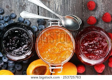 Assortment Of Jams, Seasonal Berries, Apricot, Mint And Fruits. Marmalade Or Confiture