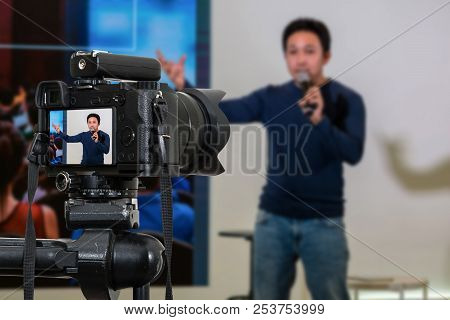 Professional Digital Mirrorless Camera With Microphone On The Tripod Recording Video Blog Of Asian S