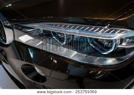 Berlin - June 09, 2018: Showroom. Headlamp Of A Mid-size Luxury Crossover Suv Bmw X6 M. Close-up.