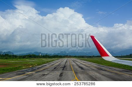 Airport Runway With Airplane Wing