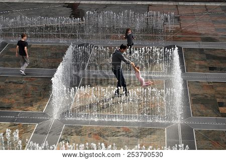 Australian People Family Playing In Fountain At Patio Outdoor Activitie In Perth, Australia