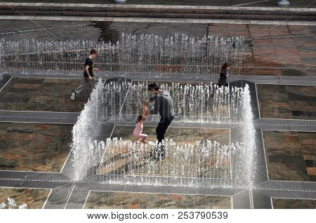Australian People Family Playing In Fountain At Patio Outdoor Activitie In Perth, Australia