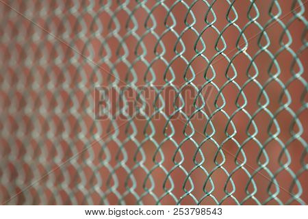 Close-up Of Isolated Painted Simple Geometric Black Iron Metal Wire Chain Link Fence Eon Dark Red Ba