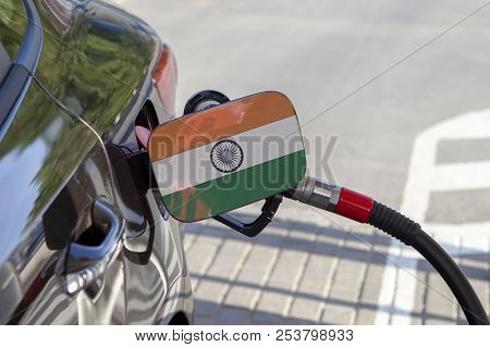 Fueling Car With Petrol Pump At A Gas Station.