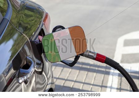Fueling Car With Petrol Pump At A Gas Station.