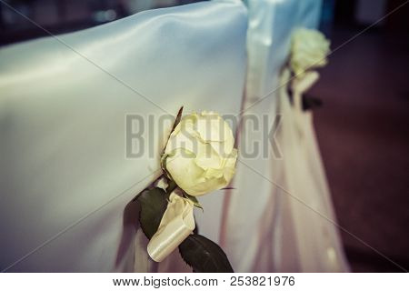 Chairs Set Up And Decorated For A Weeding In A Church