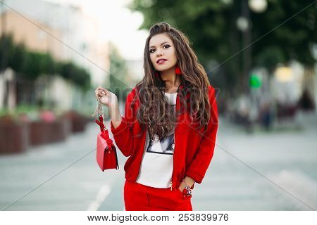 Fashionable Girl In Red Sport Chic Suit With Crossbody Bag In Th