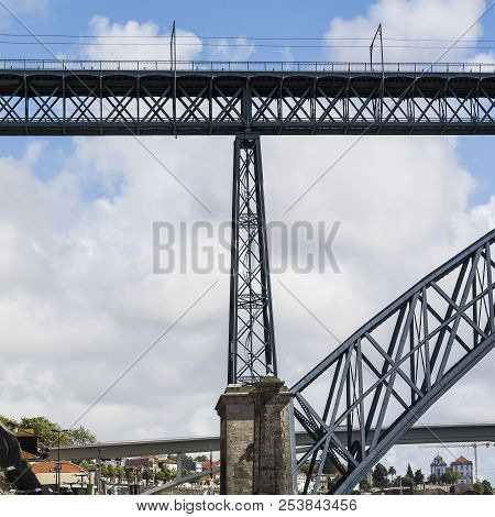 Bridge Built By Eiffel On The Bacground Of The Historical Centre Of The City Of Porto With Tradition