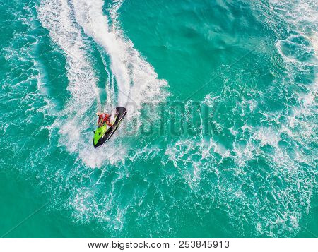 People Are Playing Jet Ski At Sea During The Holidays. Aerial View And Top View.