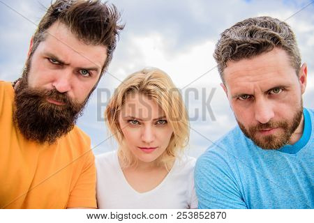 Suspicious Look. Threesome Suspiciously Look Down. Woman And Men Look Confident Sky Background. Stre