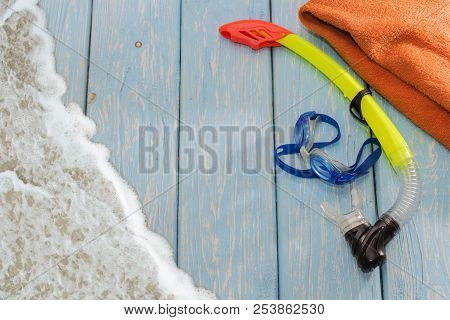 Glasses Diving Mask And Snorkel Wooden Blue Background.