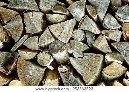 Texture Of Neatly Stacked Firewood, Beautiful Background.
