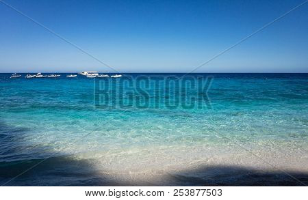 Blue Water At Cala Die Gabbiani Beach On The Italian Island Of Sardinia