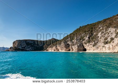 Cala Luna Beach With Famous Caves On The Italian Island Of Sardinia From Seaside