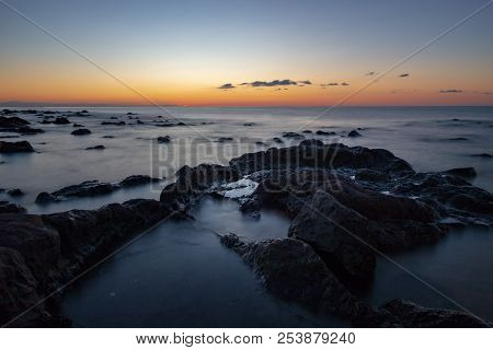 Sunrise At Palmasera Beach In Cala Gonone On The Italian Island Of Sardinia