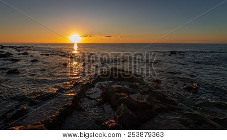 Sunrise At Palmasera Beach In Cala Gonone On The Italian Island Of Sardinia
