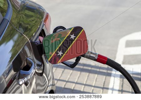 Fueling Car With Petrol Pump At A Gas Station.