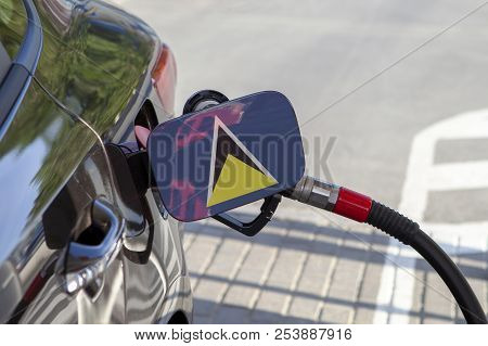 Fueling Car With Petrol Pump At A Gas Station.