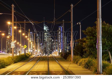 View Looking Through Gold Coasts Light Rail Tram System With Surfers Paradise Cityscape In The Backg